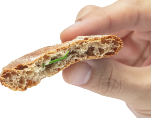 A close-up of a hand holding a piece of bread, revealing a green caterpillar inside the slice, highlighting an unexpected element in food.