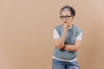 Mature woman thinking, contemplating a difficult decision