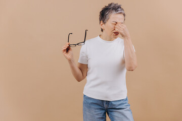 Senior woman experiencing vision problems and eye strain
