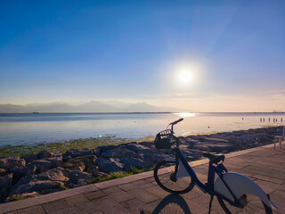 Fototapeta premium Bicycle by the Sea with Wide Coastal View on a Sunny Day