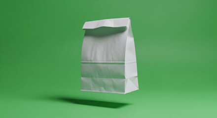 A white paper bag floats against a vivid green background