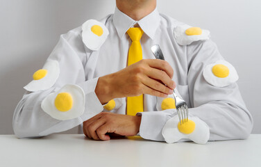 Office worker with fried eggs on shirt symbolizing burnout and routine