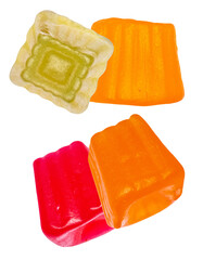 assortment of vibrant, cube-shaped fruit jellies and candies in red, orange, and green colors, displayed against a transparent background for a sweet confectionery presentation.
