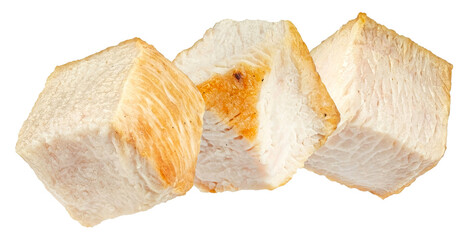 three succulent, bite-sized cubes of perfectly cooked white chicken breast, showcasing their tender texture and lightly seared golden-brown exterior, isolated against a stark transparent background.