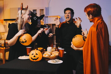 Friends enjoying a Halloween party at a bar making a toast