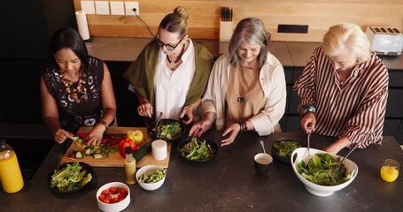 Above, kitchen and mature women with salad for bonding, conversation and culinary lesson. Cooking class, social reunion and senior friends with lunch, discussion and food for learning recipes in home