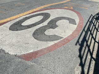 Traffic signs on the road surface, a minimum speed requirement.