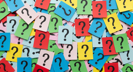 A colorful background of many question marks on small square cards
