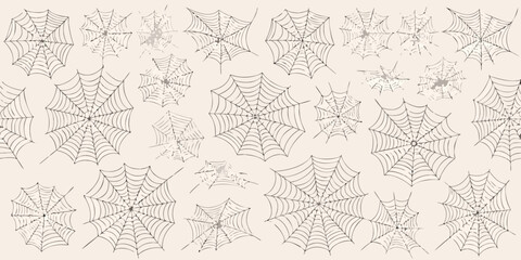 A collection of detailed spiderwebs covering a light beige background