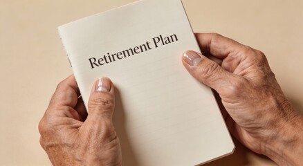 Senior hands holding a retirement plan booklet ,Active aging Finance concept.