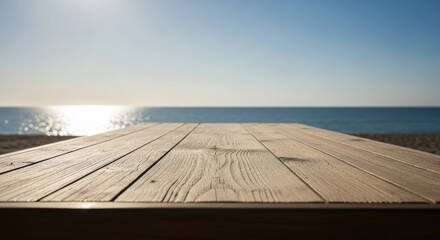 Serene beachside wooden deck overlooking calm ocean waters at sunset