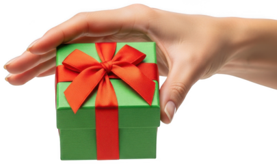 Female hand holding small green gift box with bright red ribbon and bow