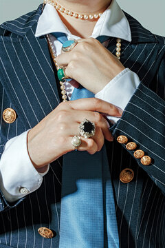 Stylish executive businesswoman with jewelry in formal pinstripe attire
