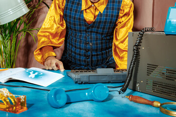 Creative retro office scene with colorful outfit and vintage desk