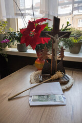 Home altar prepared for the priest's visit after Christmas carols. Donation for the church in an envelope.
