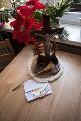 Home altar prepared for the priest's visit after Christmas carols. Donation for the church in an envelope.
