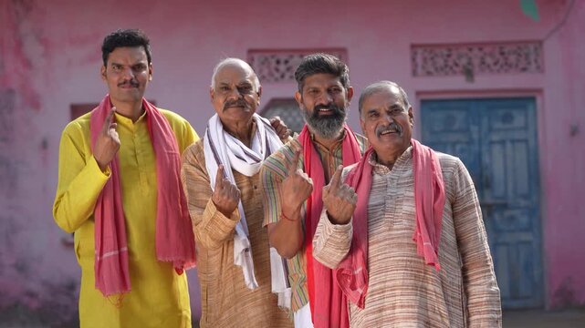indian farmers group showing voting sign 