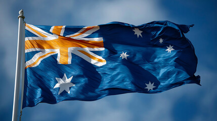 Australian National Flag Waving in the Wind Against Clear Blue Sky, Symbol of Independence, Patriotism and National Identity