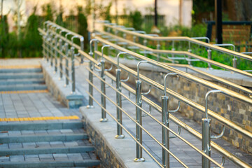 urban city square handrails close up foreground outdoor park view soft focus © Artem Kniaz