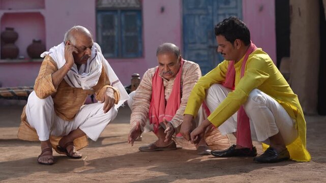 three indian farmers sitting together and discussing 