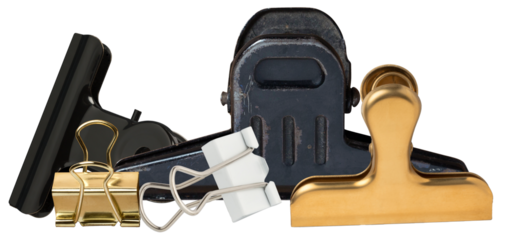 close-up of heavy-duty black bulldog clip and gold binder clip against a dark backdrop.