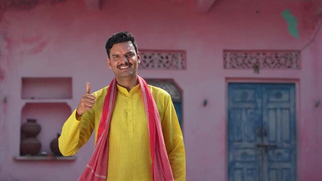 happy indian farmer showing thumps up 