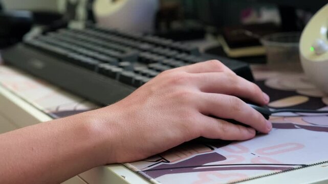 close-up of a hands typing on a computer
