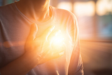 Emotional healing inner peace awellness journey concept. A warm, glowing light emanates from a person's chest in comfort