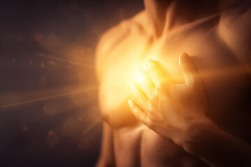 Emotional healing inner peace awellness journey concept. A warm, glowing light emanates from a person's chest in comfort