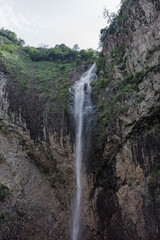 Tall Waterfall in a Rocky Canyon,Dramatic Vertical Cascade in a Natural Cliff Landscape, Shimen Cave Scenic Area, Qingtian, Lishui, Zhejiang, China