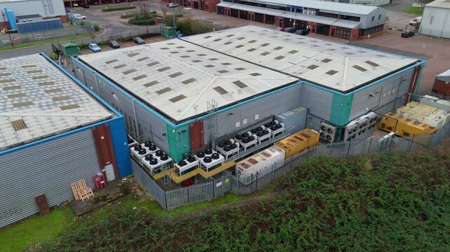 Aerial view of Node4 Data Centre showing the building's roof, cooling units, and surrounding greenery, Derby, United Kingdom.