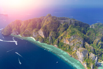 Magical paradise islands with rocks jungle forest on the coast of atoll coral reefs in Andaman Sea...