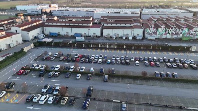 Aerial view of a busy roundabout and McDonald's restaurant with cars in Italy