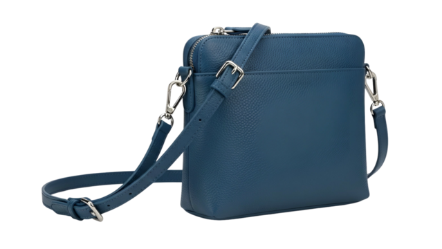 A rectangular, teal leather crossbody bag with silver hardware and textured surface, isolated - Powered by Adobe