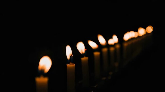 Candlelight Ceremony - A Row of Lit Candles in the Darkness, Creating a Warm Glow.