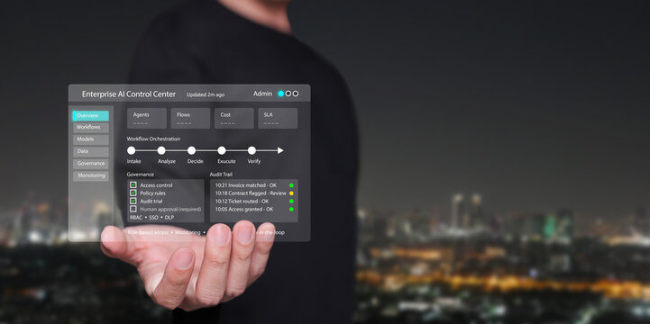 Businessman holding enterprise AI control center with smart city background. Digital leadership, automation, data governance, agentic enterprise, and artificial intelligence at the corporate level.