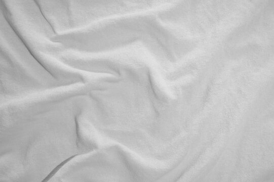 Stofftextur mit Falten in weiss