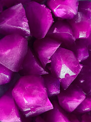 Vibrant magenta ice cubes texture for food background