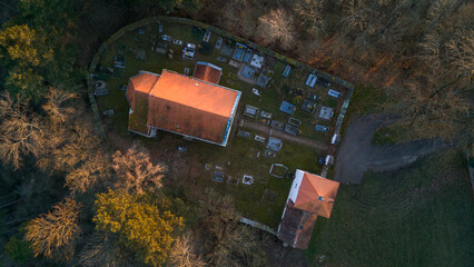 Aerial view of St. Wenceslaus Church in Habrina, Czech Republic, at golden hour.
