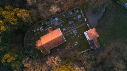 Aerial view of St. Wenceslaus Church in Habrina, Czech Republic, at golden hour.