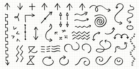 Collection of hand drawn arrows lines and various doodle style symbols on grid paper