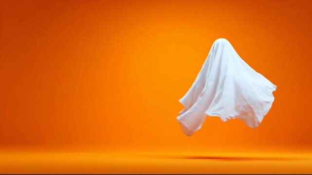 A floating ghost figure in a vibrant orange background.