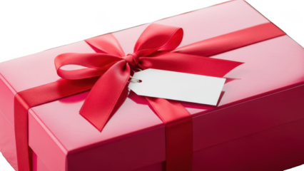 Close up of pink glossy gift box with red ribbon and white hanging tag