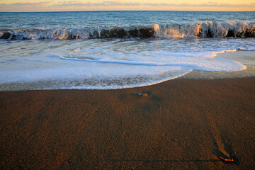 waves crashing on rocks near the sea