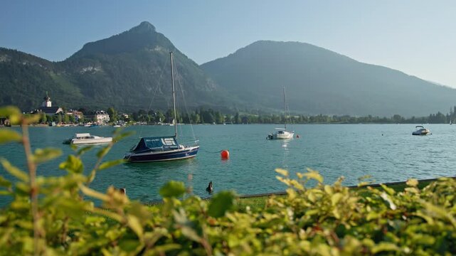Beautiful boats on the shore of Wolfgangsee Austria. Boats and dinghies moored on the shore of an alpine village.