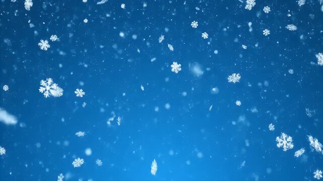 Delicate white snowflakes falling on a blue winter background.