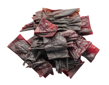A heap of dark red, wrinkled, square-cut pieces of dried meat. The thin, leathery slices appear savory and chewy.