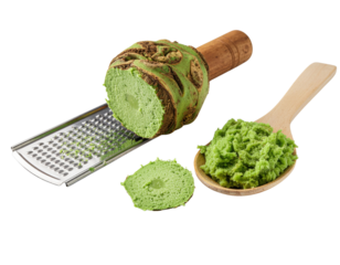 Fresh wasabi root, a metal grater, and freshly prepared green wasabi paste on a wooden spoon.