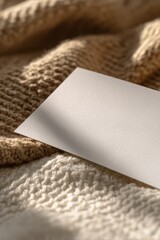 Blank sheet of notepaper on a textured surface, ready for notes