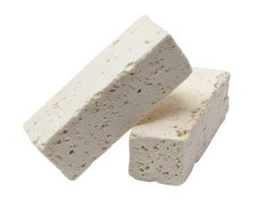 Two rectangular blocks of firm, pressed tofu with a porous texture.